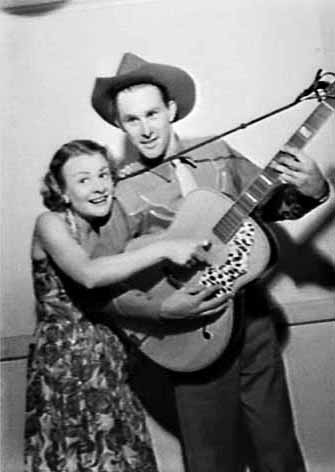 Country singer Reg Lindsay with Joan Clarke on the Hour of Song radio program in 1954